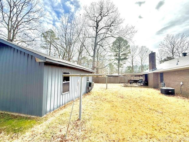 view of yard featuring central AC