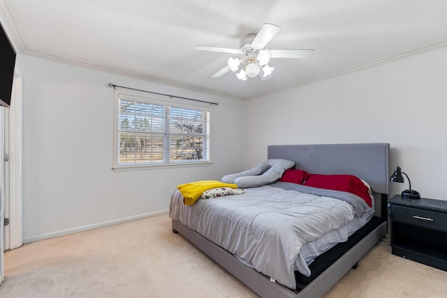 bedroom with ornamental molding, carpet flooring, and baseboards