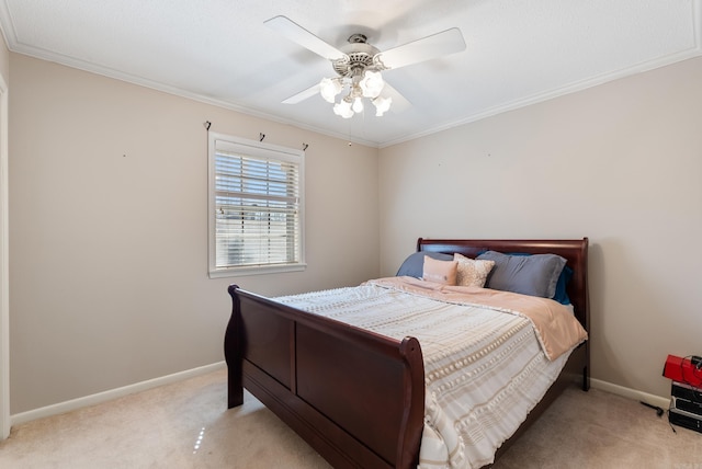 bedroom featuring light carpet, baseboards, and crown molding