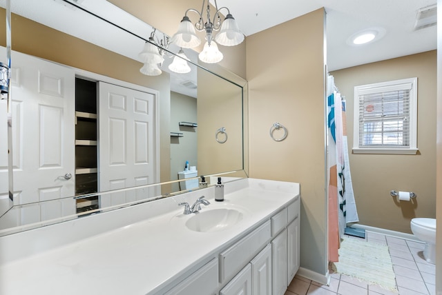 full bathroom with visible vents, baseboards, toilet, tile patterned flooring, and vanity