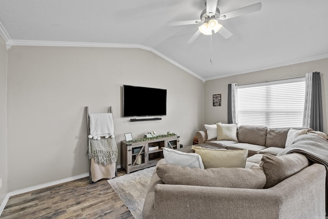 living room featuring lofted ceiling, crown molding, a ceiling fan, and wood finished floors