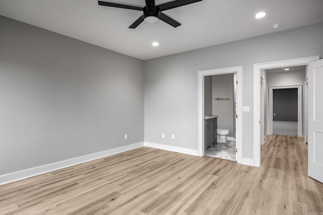 unfurnished bedroom with ensuite bath, light wood-style flooring, baseboards, and recessed lighting