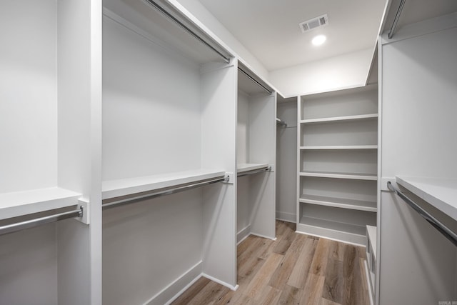 walk in closet featuring visible vents and light wood-style floors