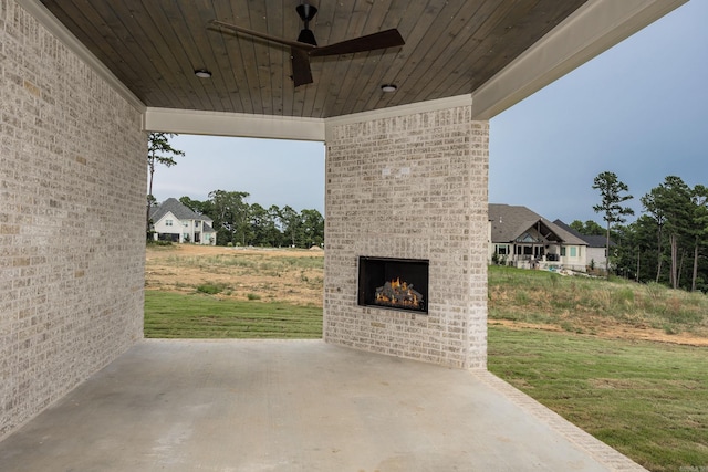 view of patio / terrace with an outdoor brick fireplace