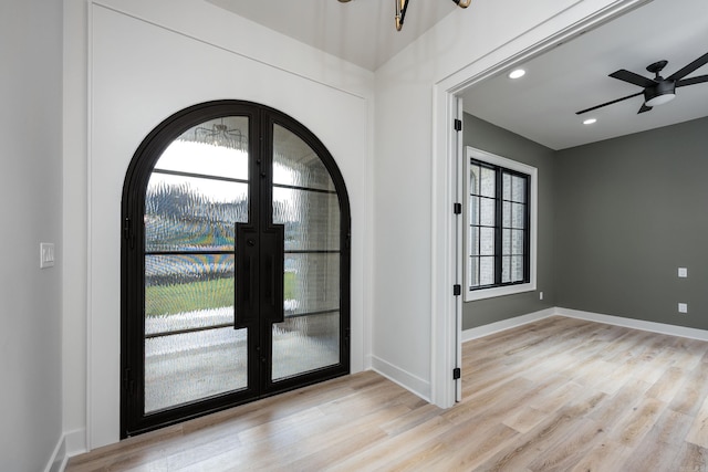 foyer entrance featuring recessed lighting, wood finished floors, a ceiling fan, baseboards, and french doors