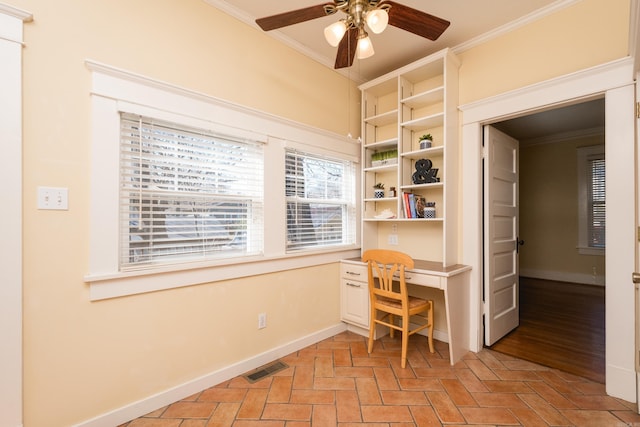 unfurnished office featuring visible vents, baseboards, and crown molding