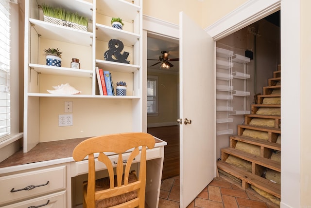 office featuring built in study area and ceiling fan