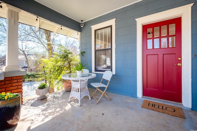 doorway to property with covered porch