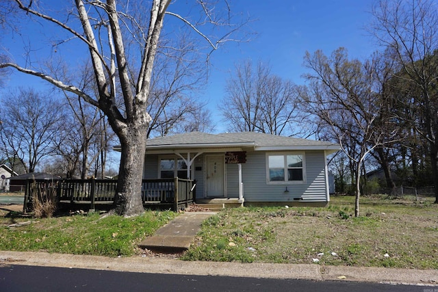 view of front of house with a shingled roof and covered porch