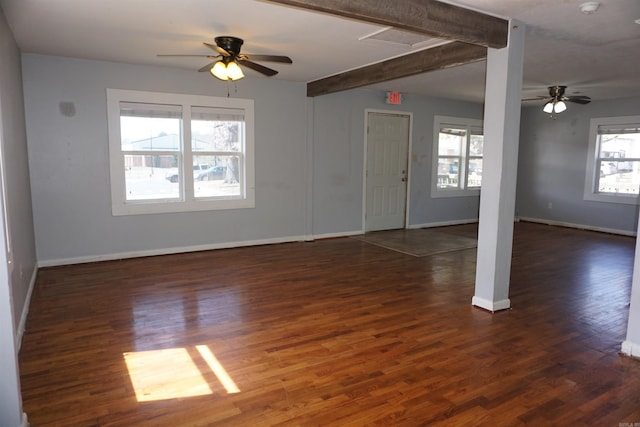 interior space with a ceiling fan, baseboards, and wood finished floors