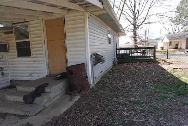 exterior space with a deck and faux log siding