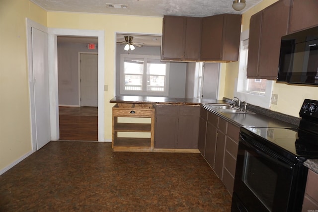 kitchen with black appliances, plenty of natural light, visible vents, and a sink