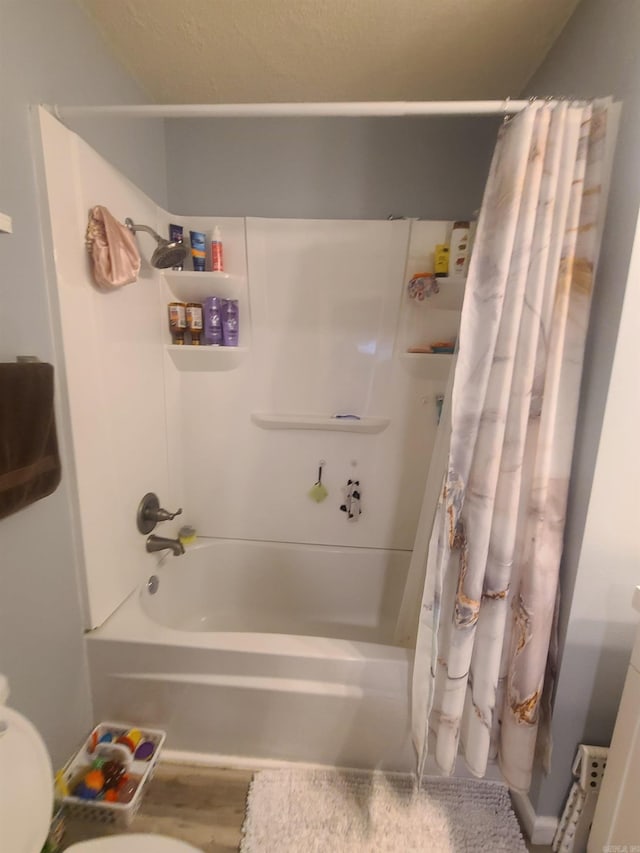 full bath with shower / bath combo and toilet