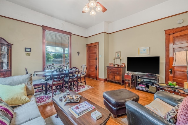 living room featuring ceiling fan and wood finished floors