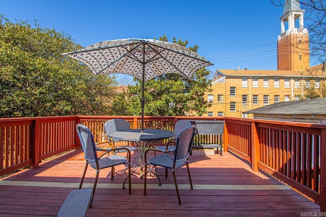 deck with outdoor dining area