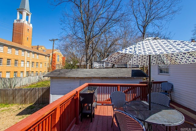 wooden deck featuring fence