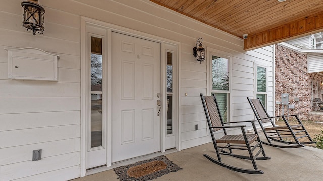 doorway to property featuring covered porch