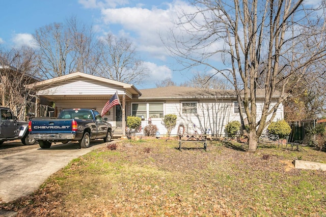 ranch-style house featuring concrete driveway