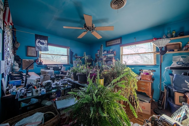 miscellaneous room with ceiling fan, visible vents, and wood finished floors