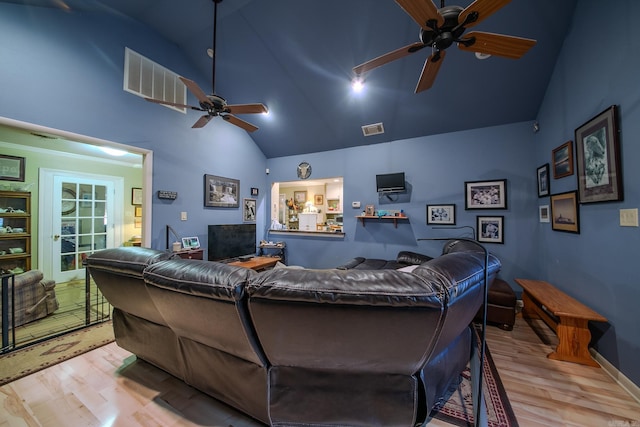 interior space with high vaulted ceiling, ceiling fan, visible vents, and wood finished floors