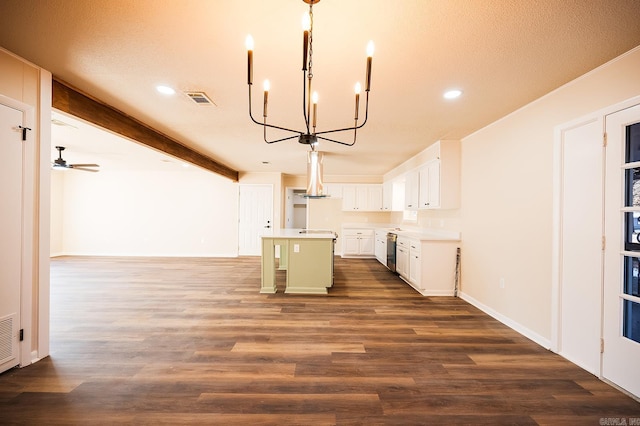 kitchen featuring a center island, visible vents, dark wood-type flooring, open floor plan, and beamed ceiling