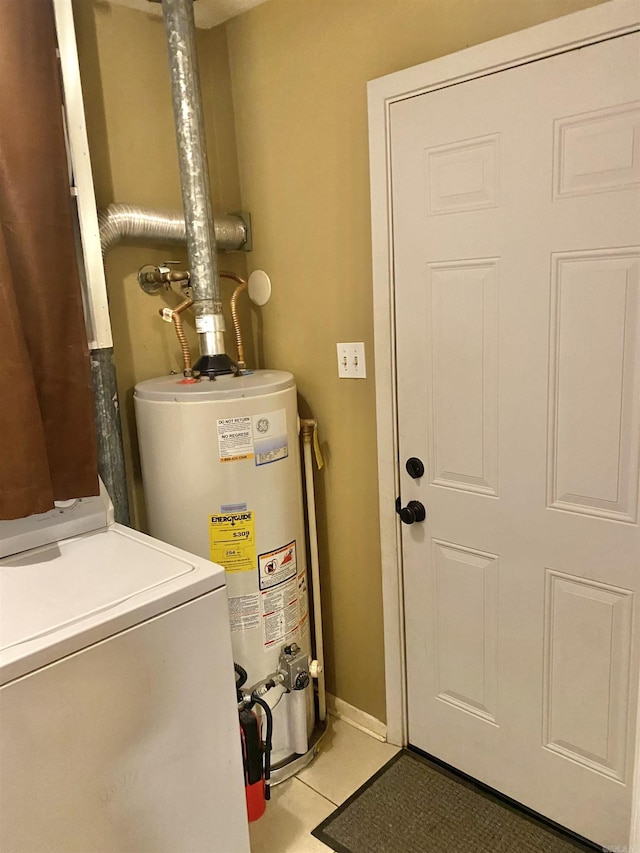 utilities featuring gas water heater and washer / dryer