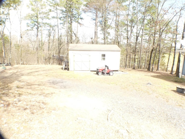 exterior space with a shed