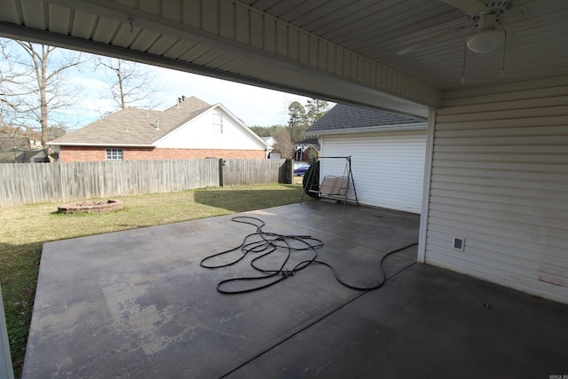 view of patio / terrace with fence and a ceiling fan