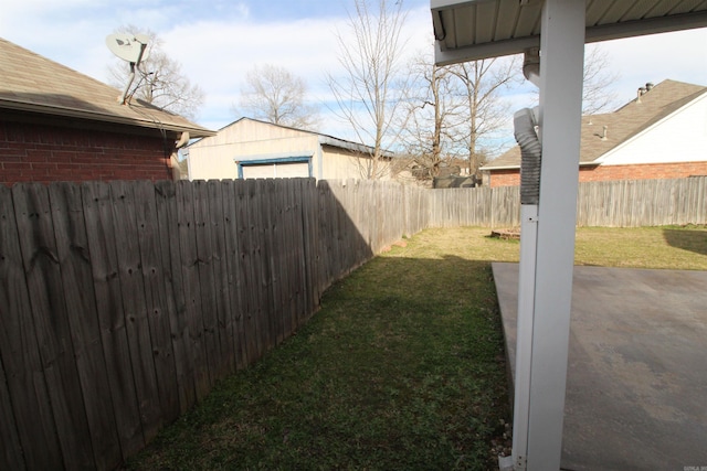 view of yard with a patio and a fenced backyard