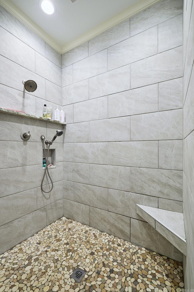 bathroom with tiled shower