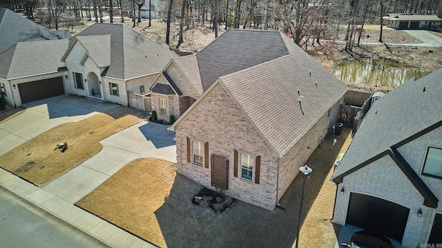 birds eye view of property featuring a water view