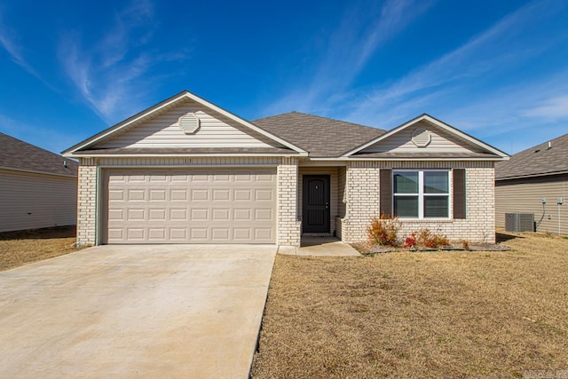 ranch-style home with a garage, driveway, a front lawn, and brick siding