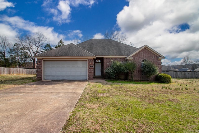 ranch-style home with concrete driveway, brick siding, an attached garage, and fence