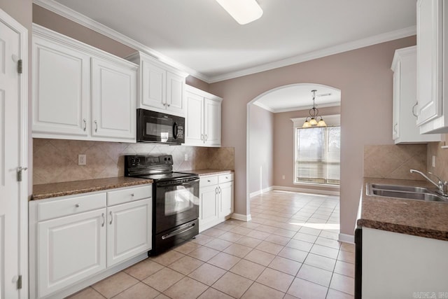 kitchen featuring arched walkways, light tile patterned floors, a sink, white cabinets, and black appliances