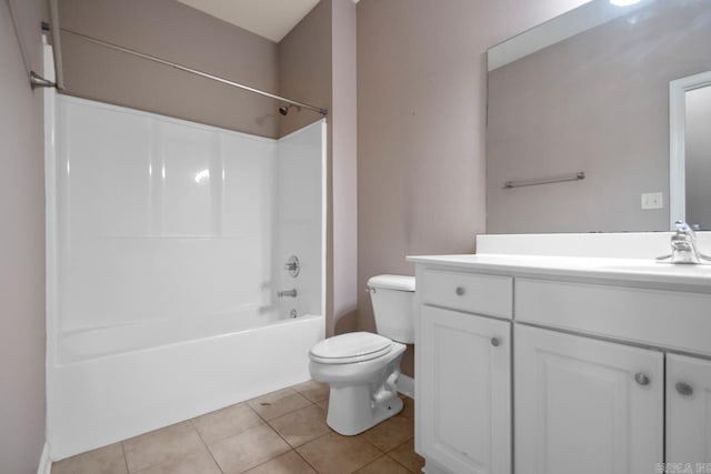 bathroom featuring toilet, tile patterned flooring, shower / bathing tub combination, and vanity