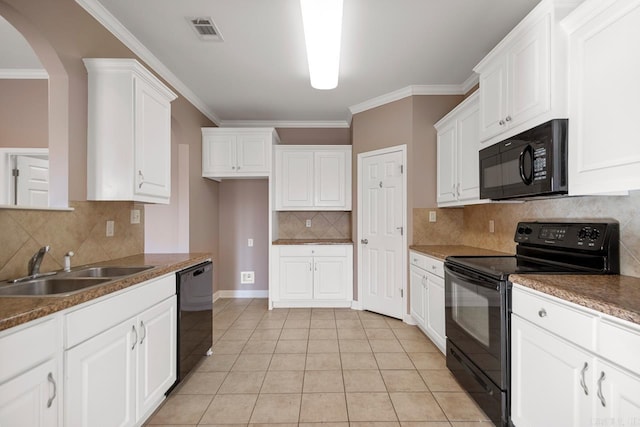 kitchen with visible vents, crown molding, black appliances, white cabinetry, and a sink