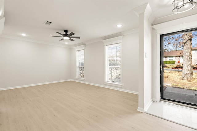 entryway with recessed lighting, visible vents, baseboards, ornamental molding, and light wood finished floors