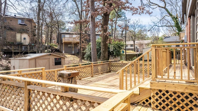 wooden terrace with a shed and an outdoor structure