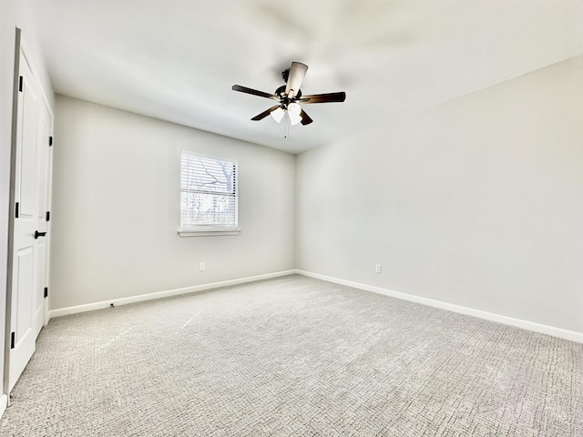 unfurnished room featuring baseboards, a ceiling fan, and light colored carpet