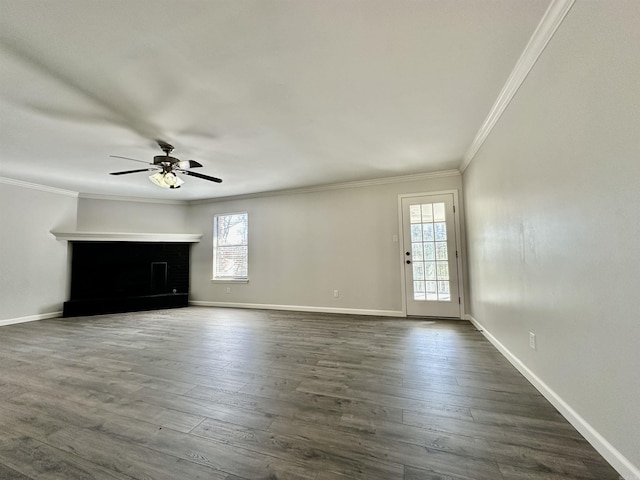 unfurnished living room featuring baseboards, dark wood-style flooring, a ceiling fan, and crown molding