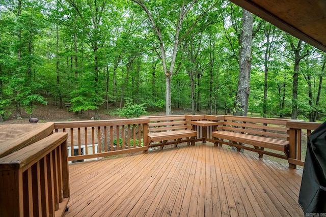 wooden terrace with a forest view