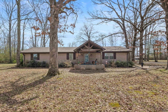 ranch-style home featuring brick siding