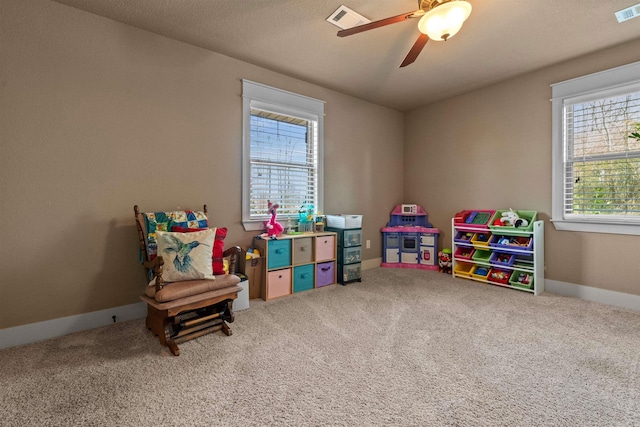 recreation room featuring carpet floors, baseboards, and visible vents