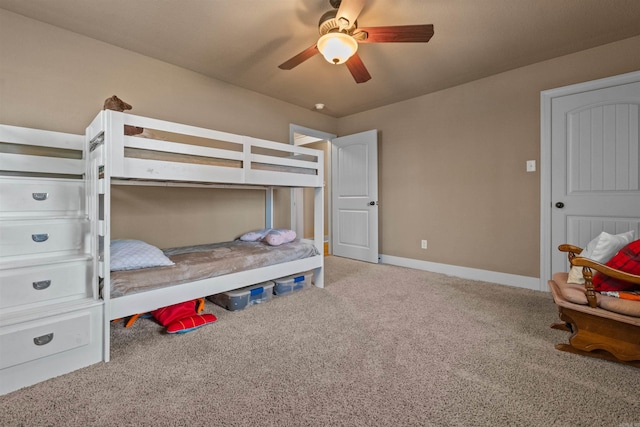 carpeted bedroom featuring ceiling fan and baseboards