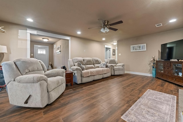 living area featuring baseboards, dark wood-style flooring, a ceiling fan, and recessed lighting