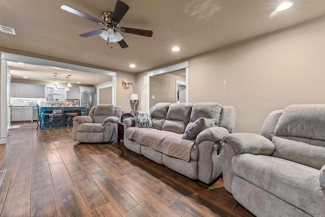 living room with recessed lighting, visible vents, dark wood finished floors, and ceiling fan