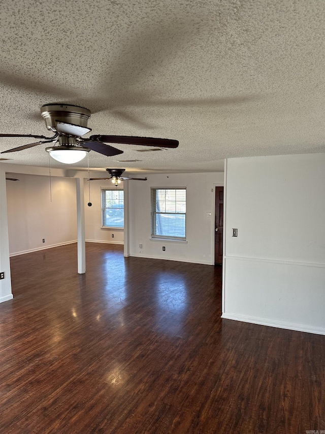 empty room featuring baseboards and wood finished floors