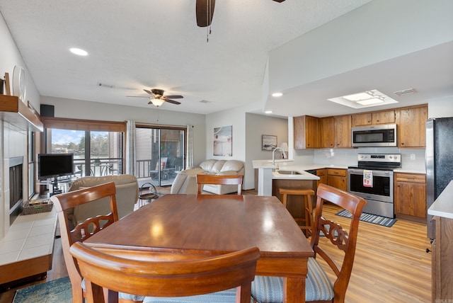 dining space with recessed lighting, visible vents, ceiling fan, and light wood finished floors