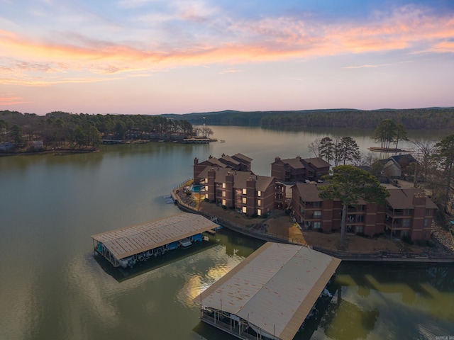 aerial view at dusk with a water view