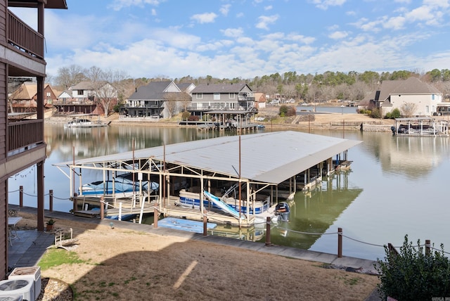 dock area with a water view and a residential view